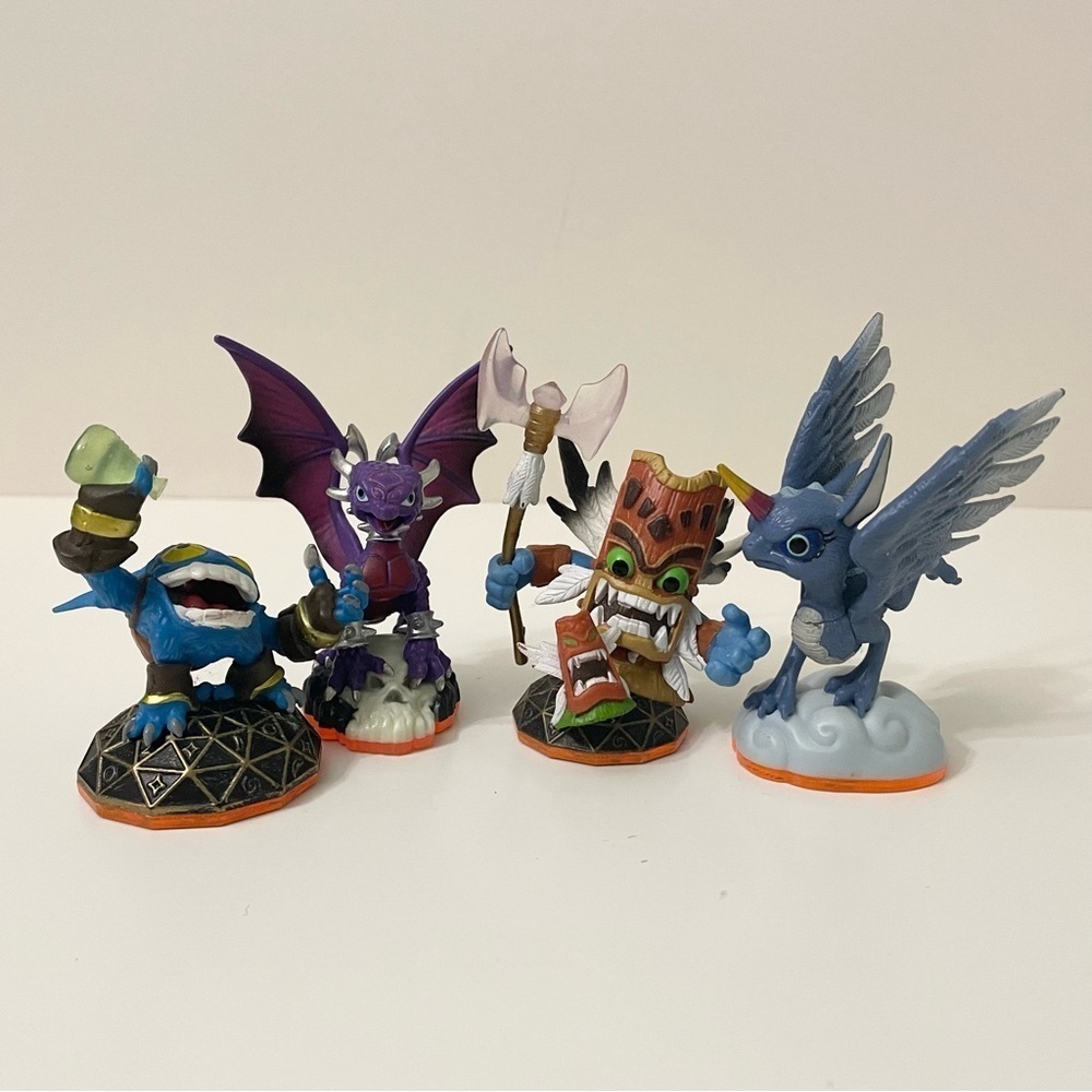 Lot of 4 Skylanders Figures Whirlwind Cynder Double Trouble Totem Pop Fizz
